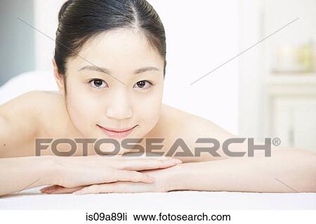 Portrait of woman relaxing in spa View Large Photo Image Stock Image - Portrait of woman relaxing in spa. Fotosearch
