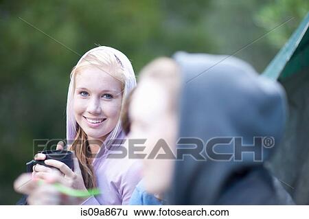 Portrait of young girl with drinks flask View Large Photo Image Stock Photograph - Portrait of young girl with drinks flask. Fotosearch