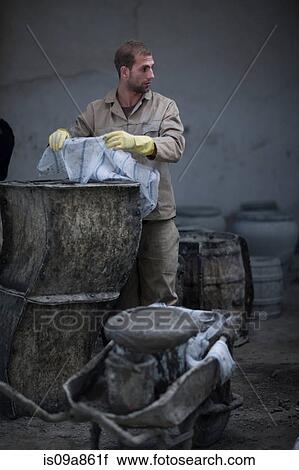 Stock Image - Potters working. Fotosearch