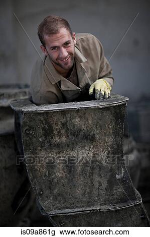 Stock Image - Potters working. Fotosearch