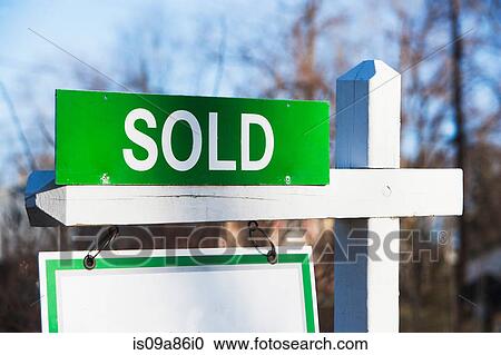 Stock Image - Property sold sign, close up. Fotosearch