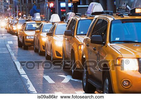 Queue of yellow taxis, New York City, USA View Large Photo Image Stock Photography - Queue of yellow taxis, New York City, USA. Fotosearch