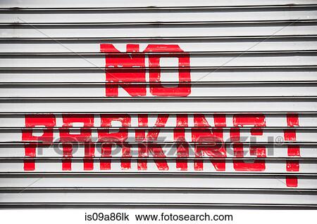 Stock Image - Red hand painted no parking sign. Fotosearch