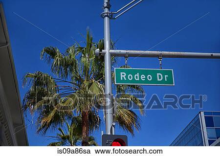Rodeo Drive sign on traffic signal View Large Photo Image Stock Image - Rodeo Drive sign on traffic signal. Fotosearch