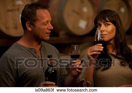 Sampling wine in barrels View Large Photo Image Stock Image - Sampling wine in barrels. Fotosearch