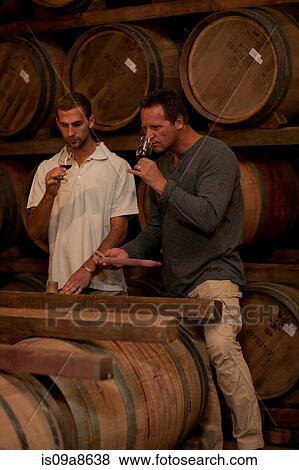 Sampling wine in barrels View Large Photo Image Stock Photo - Sampling wine in barrels. Fotosearch