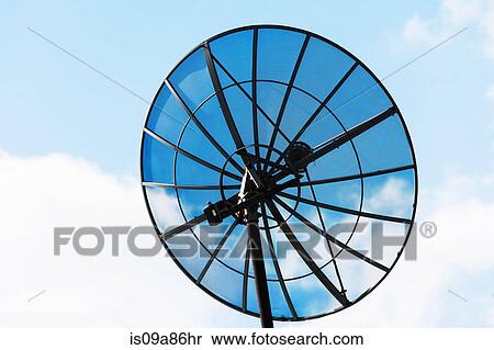 Stock Photography - Satellite dish against cloudy sky. Fotosearch