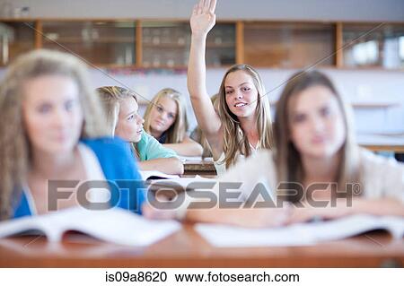 Stock Image - School girls enjoying science lesson. Fotosearch