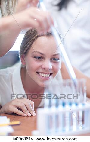 School girls enjoying science lesson View Large Photo Image Stock Photo - School girls enjoying science lesson. Fotosearch