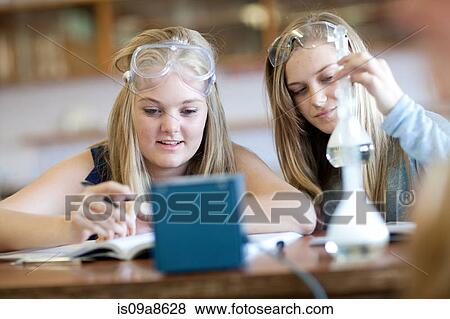 School girls enjoying science lesson View Large Photo Image Stock Photo - School girls enjoying science lesson. Fotosearch