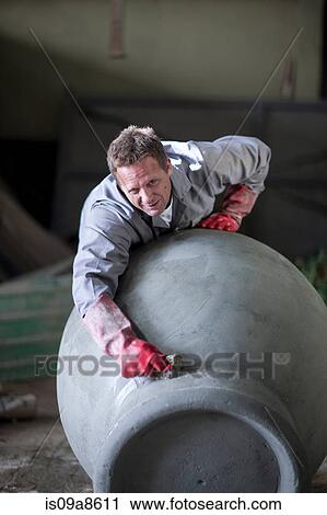 Sculpting and shaping pottery View Large Photo Image Stock Image - Sculpting and shaping pottery. Fotosearch