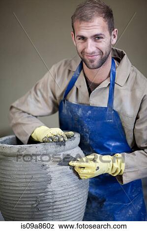 Sculpting and shaping pottery View Large Photo Image Stock Photo - Sculpting and shaping pottery. Fotosearch