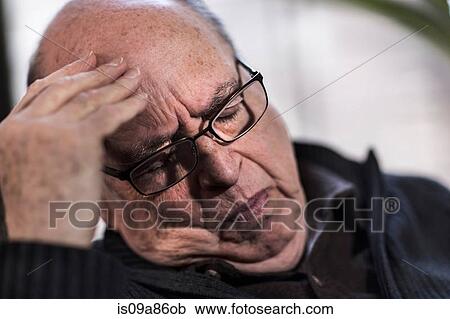 Senior man with eyes closed, wearing glasses, looking stressed View Large Photo Image Stock Image - Senior man with eyes closed, wearing glasses, looking stressed. Fotosearch