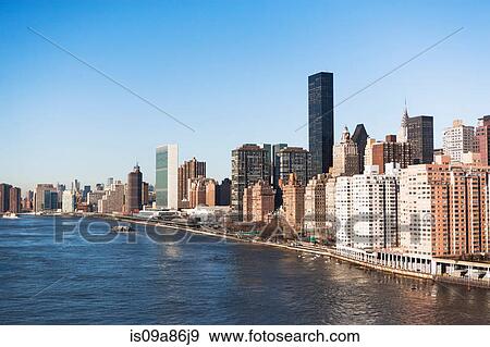 Skyscrapers and buildings along Hudson River in New York City, USA View Large Photo Image Stock Photo - Skyscrapers and buildings along Hudson River in New York City, USA. Fotosearch