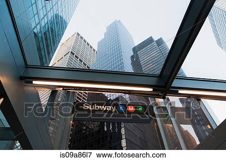 Stock Photo - Skyscrapers and subway entrance, New York City, USA. Fotosearch