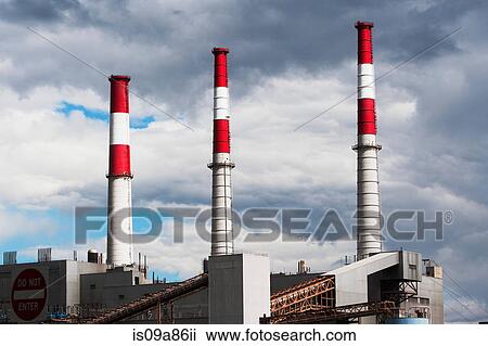 Stock Image - Smoke stacks of power plant. Fotosearch