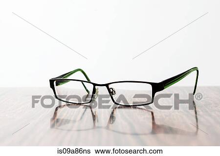 Stock Photograph - Spectacles on table. Fotosearch