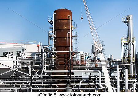 Storage tanks of oil refinery View Large Photo Image Stock Photo - Storage tanks of oil refinery. Fotosearch