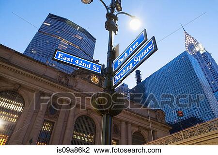 Stock Image - Street signs outside Grand Central station at dusk, New York City, USA. Fotosearch