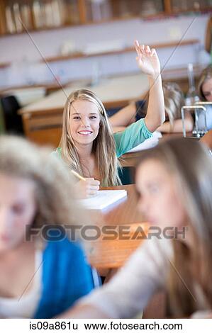 Student putting her hands up View Large Photo Image Stock Photograph - Student putting her hands up. Fotosearch