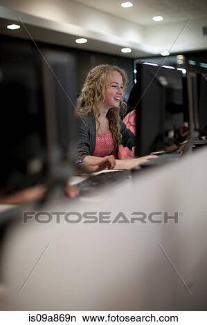 Picture - Students using computers in class. Fotosearch