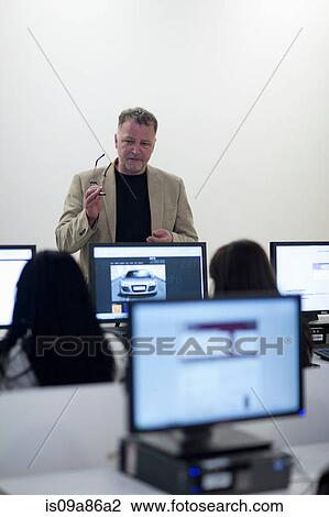 Stock Image - Students using computers in lecture. Fotosearch