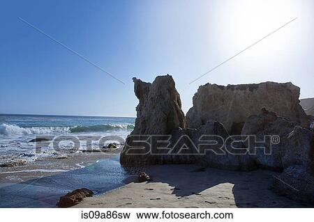Sunlight over El Matador Beach, Malibu, California, USA View Large Photo Image Stock Photo - Sunlight over El Matador Beach, Malibu, California, USA. Fotosearch