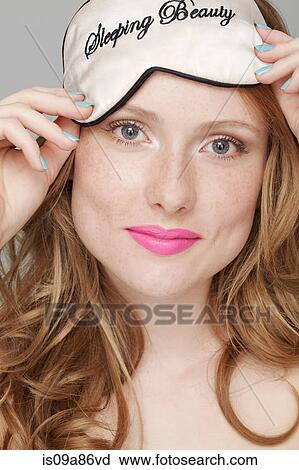 Teenage girl wearing Sleeping Beauty eye mask on head View Large Photo Image Stock Image - Teenage girl wearing Sleeping Beauty eye mask on head. Fotosearch