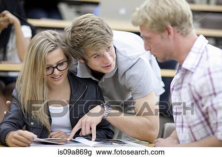 Three students talking View Large Photo Image Stock Image - Three students talking. Fotosearch