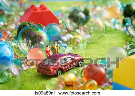 Toy car and figurines with bubbles View Large Photo Image Stock Image - Toy car and figurines with bubbles. Fotosearch