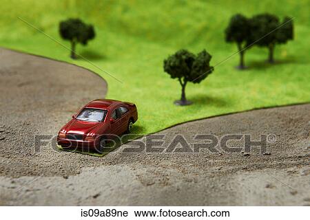 Toy car on model landscape View Large Photo Image Stock Image - Toy car on model landscape. Fotosearch