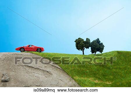 Toy car on model landscape View Large Photo Image Stock Photography - Toy car on model landscape. Fotosearch