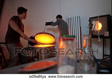 Two men working in glass factory View Large Photo Image Stock Image - Two men working in glass factory. Fotosearch