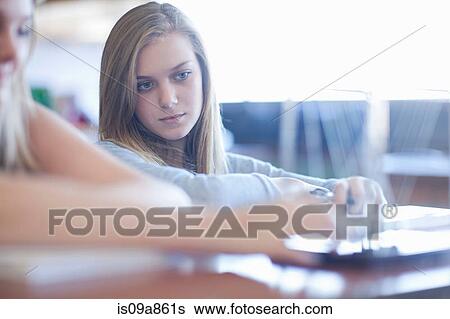 Stock Photograph - Waiting for chemical reaction in science lesson. Fotosearch