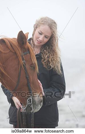 Woman with horse on beach View Large Photo Image Stock Photo - Woman with horse on beach. Fotosearch