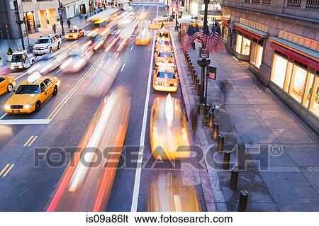 Yellow cabs in a row on busy road New York City, USA View Large Photo Image Stock Photograph - Yellow cabs in a row on busy road New York City, USA. Fotosearch