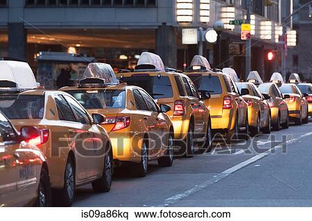 Stock Photography - Yellow taxis in a row, New York City, USA. Fotosearch