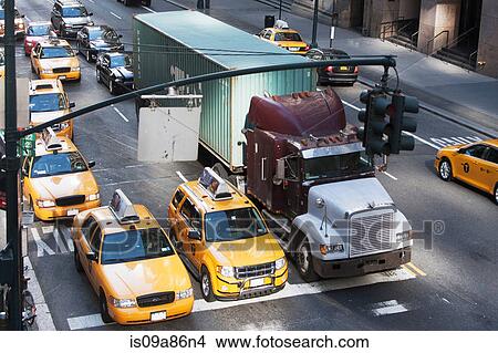 Picture - Yellow taxis waiting at traffic lights, New York City, USA. Fotosearch