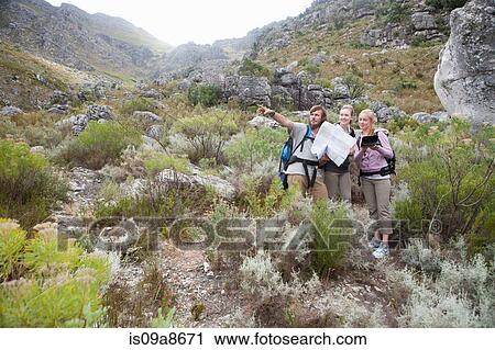 Young hikers planning route View Large Photo Image Stock Image - Young hikers planning route. Fotosearch