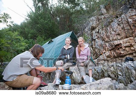 Young people camping View Large Photo Image Stock Image - Young people camping. Fotosearch