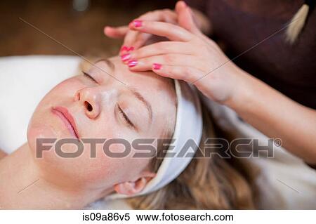 Young woman having facial treatment View Large Photo Image Stock Photography - Young woman having facial treatment. Fotosearch