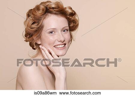 Picture - Young woman with curly red hair, portrait. Fotosearch