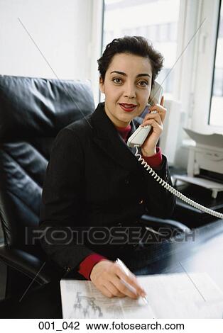 Business woman on phone View Large Photo Image Stock Image - Business woman on phone. Fotosearch