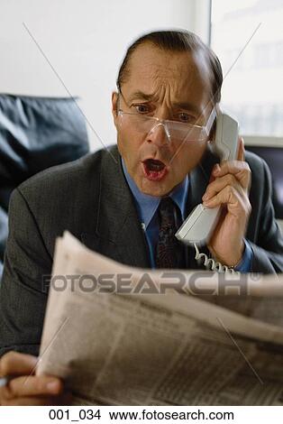 Businessman on phone View Large Photo Image Picture - Businessman on phone. Fotosearch