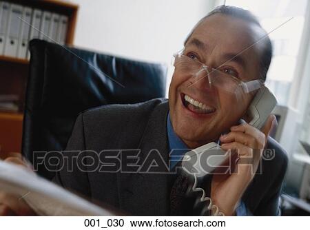 Businessman on phone View Large Photo Image Stock Image - Businessman on phone. Fotosearch