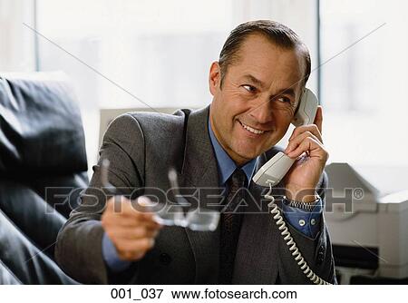 Businessman on phone View Large Photo Image Stock Photo - Businessman on phone. Fotosearch