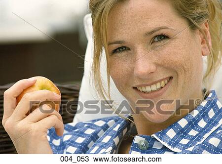 Woman with apple View Large Photo Image Stock Image - Woman with apple. Fotosearch