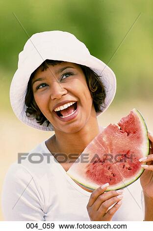 Stock Photo - Woman with melon. Fotosearch