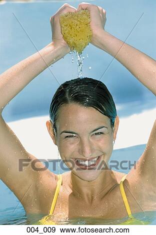 Woman with sponge View Large Photo Image Stock Photo - Woman with sponge. Fotosearch