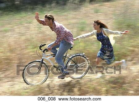 Stock Photo - Couple cycling. Fotosearch